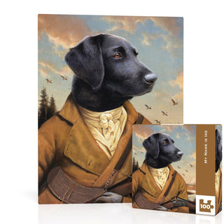 The My Name is Ike Mini | 100 Piece Jigsaw Puzzle by New York Puzzle Company features Bill Mayers art of a black dog in vintage hunting attire with a landscape and flying birds. Made in the USA.