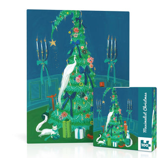 The Maximalist Christmas Mini, a 100-piece jigsaw puzzle by New York Puzzle Company, features Janet Hill’s art of a tall, curved Christmas tree with blue bows, white birds, gifts, candles, and a white cat on the box and pieces.