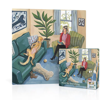 A woman relaxes on a green couch with a book while her dog lounges nearby, and a cat rests on the floor. Surrounded by lush plants, big windows, and framed art, this inviting scene by artist Jenny Kroik comes to life in "Woof Me Everything," a 100-piece jigsaw puzzle from New York Puzzle Company.
