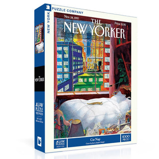 Cat Nap | 1,000 Piece Jigsaw Puzzle by New York Puzzle Company features Jean-Jacques Sempé’s charming art of a cat napping near a window with a city view—perfect for cat lovers and fans of iconic New Yorker magazine covers.