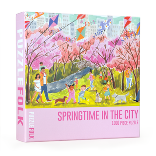 The Springtime in the City | 1,000 Piece Jigsaw Puzzle by Puzzlefolk features an Emma Block illustration of people and dogs enjoying a park with blooming trees and kites—a charming spring scene for all ages.
