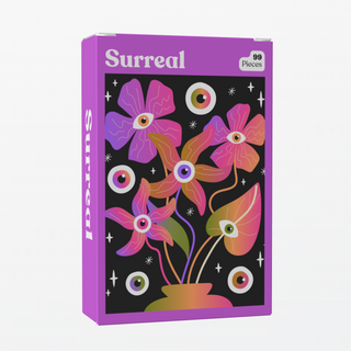 Puzzledly’s Surreal | 99 Piece Jigsaw Puzzle is a pocket-sized box featuring colorful flowers and leaves with eye centers on a starry black background—mini decor with 99 ribbon-cut pieces.