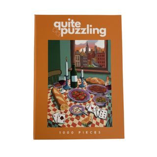 Raise & Refill by Quite Puzzling is a 1,000-piece jigsaw puzzle with an illustrated dinner table featuring wine, bread, cheese, cards, and a city view—perfect for your coffee table.