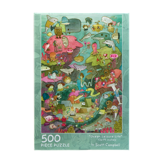 An Ocean Life | 500 Piece Jigsaw Puzzle box featuring an illustrated underwater camp scene filled with cartoon sea creatures, divers, and coral reefs.
