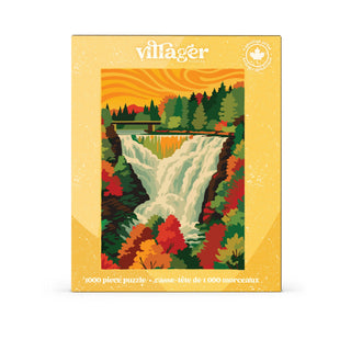 Autumn Cascade | 1,000 Piece Jigsaw Puzzle by Villager Puzzles features an illustrated scene of Kakabeka Falls, with a forest and bridge under an orange sky. The box showcases text in English and French, a maple leaf symbol in the top right corner, and stunning autumn foliage inspired by Canadian art.