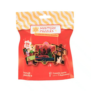 A sealed red bag containing a 99-piece Marion Brouillon Mystery Puzzle by Trevell, featuring illustrations of desert landscapes, a picnic, and a cat.