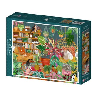 The Pieces & Peace "Boho Cats" 1,000-piece jigsaw puzzle, made in France, features an illustrated indoor scene with cats, plants, bookshelves, and hanging chairs.