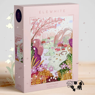 The Elewhite Valley Bloom | 500 Piece Jigsaw Puzzle showcases an original spring valley scene with flowers, trees, and houses on a premium puzzle board.