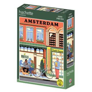 The Hachette Puzzle "Amsterdam | 1,000 Piece Jigsaw Puzzle" features a fagostudio city scene with a waffle shop, people, and bicycles. Made in France.