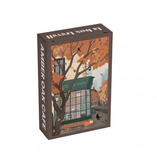 The Trevell Amber Oak Cafe | 99 Piece Jigsaw Puzzle features a charming illustration of Amber Oak Café in autumn, complete with orange leaves, black birds, and a pumpkin outside the shop. This puzzle is proudly made in Turkey.