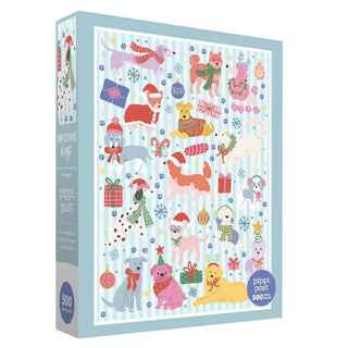 The Pippi Post Christmas Dogs | 500 Piece Jigsaw Puzzle showcases charming illustrated dogs dressed in festive outfits, surrounded by presents, bones, hats, and snowflakes on a blue striped background—making it the perfect Christmas gift for dog lovers.