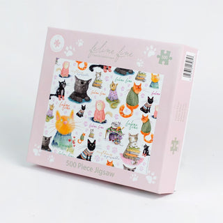 The "Feline Fine" 500 Piece Jigsaw Puzzle by All Jigsaw Puzzles features a quirky cat design in vibrant pink—perfect for cat lovers and puzzle fans alike.