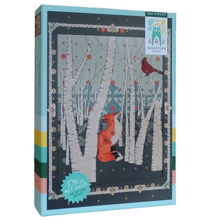 The Fox and Cardinal | 500 Piece Jigsaw Puzzle by Bridgetown Puzzles showcases an illustrated red fox and cardinal in a birch forest, with 10% of net sales going to the artist.