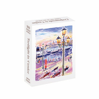 Experience the enchanting charm of Venice with the WEVE “Twilight in Venice” 300 Piece Jigsaw Puzzle—a beautifully illustrated scene depicting gondolas gliding on twilight waters, glowing street lamps, and leisurely strollers. Crafted from premium blue board for a velvet-like soft touch, this puzzle offers a luxurious and delightful assembling experience.