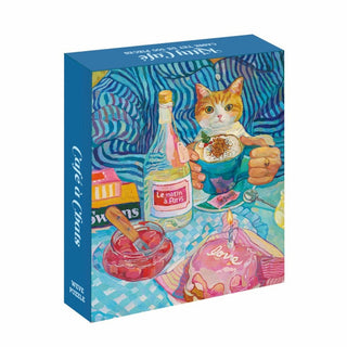 The WEVE Kitty Café 500 Piece Jigsaw Puzzle features an orange and white cat at a dessert table with “Le matin à Paris” bottle and a Love cake, crafted from premium blue board and recycled paper.