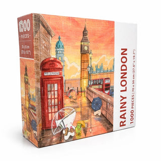 Arcadia Puzzles' Rainy London 1,000 Piece Jigsaw Puzzle features Big Ben, a red phone booth, umbrellas, and a double-decker bus—beautifully illustrated and packaged sustainably.