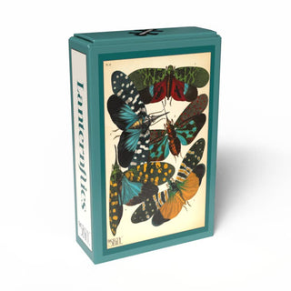 A teal box featuring a vintage illustration of six vibrant moths and butterflies graces the front, while the side displays “Lanternflies” in bold black text. Inspired by E. A. Séguy’s iconic designs, this charming Lanternflies | 99 Piece Jigsaw Puzzle from Penny Puzzle makes a perfect vintage mini puzzle for collectors and nature enthusiasts alike.