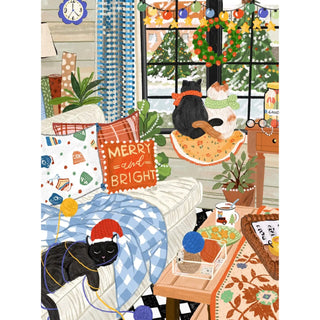 A cozy living room with two black cats, yarn balls, festive decor, snow outside, and a “Merry and Bright” pillow comes to life in Puzzlefolk’s A Cozy Cat Christmas | 1,000 Piece Jigsaw Puzzle.
