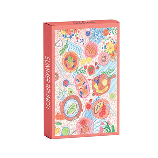 The Olleo Puzzles Summer Brunch | 99 Piece Jigsaw Puzzle comes in a rectangular box with vibrant breakfast foods and flowers, perfect for gourmet brunch fans.