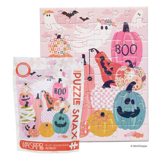 A finished Pumpkin Party | 48 Piece Jigsaw Puzzle by WerkShoppe, showcasing a pastel Halloween scene with pumpkins, ghosts, and a cat beneath cheerful “BOO” text, is displayed beside its matching packaging. This delightful puzzle is perfect for adding a festive touch to your Halloween celebrations.