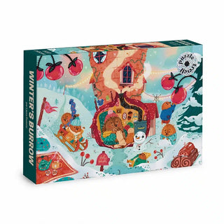 Trevell’s Winter’s Burrow | 500 Piece Jigsaw Puzzle showcases a cozy woodland scene with animals, a whimsical house, snow, and festive décor.