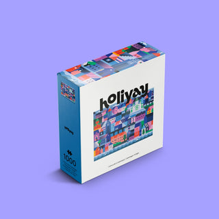 A 1,000-piece Holiyay Puzzles jigsaw puzzle box, titled "Crépuscule De Copenhague," features a colorful illustration of a cityscape with various geometric buildings by Myriam Van Neste. The puzzle box is displayed on a solid light purple background.