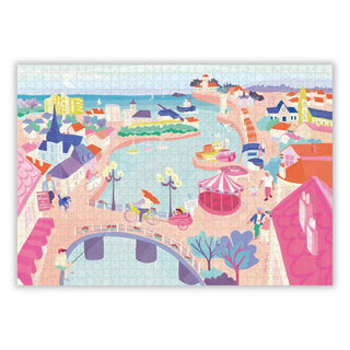 La Vie Devant Soi by Aparté is a vibrant 1,000-piece jigsaw puzzle illustrated by Telma Berrie, featuring a bustling seaside town with boats, buildings, carousel, bridge, and people strolling the waterfront.