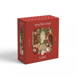 The Spring Witch Cottage | 280 Piece Jigsaw Puzzle by la pauz features a vibrant red box adorned with an illustration of a cozy, magical room. This beautifully designed puzzle captures the enchanting charm of the Spring Witch Cottage and includes 280 mini pieces, offering hours of whimsical fun.
