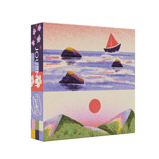 Journey by Cloudberries is a premium 1,000-piece jigsaw puzzle in a square box, featuring illustrated scenes: a sailboat on water with rocks, a mountain landscape with a red sun, and floral patterns on the left edge.