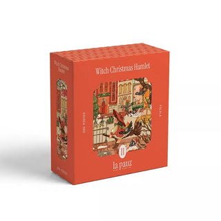 A red box labeled Witch Christmas Hamlet features a festive winter puzzle image with the brand name la pauz on the front. This Witch Christmas Hamlet puzzle is a 280-piece holiday jigsaw, perfect for cozy seasonal fun.