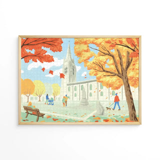 Autumn park scene with orange trees, people strolling, a bench sitter, and a large church under a blue sky—ideal for Aparté's Marennes | 1,000 Piece Jigsaw Puzzle.