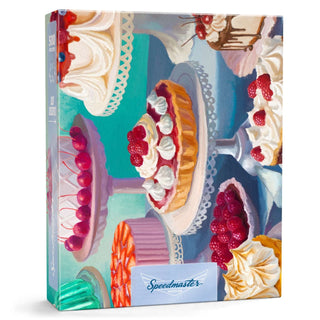 Just Desserts is a 500-piece jigsaw puzzle by Boardwalk Puzzle Company, featuring vibrant cakes and desserts on stands with whipped cream and cherries—a delightful challenge for adults.