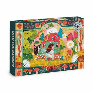 Trevell’s Into the Garden | 1,000 Piece Jigsaw Puzzle features a whimsical illustration by Laura Proietti, depicting a garden scene with a mushroom house, vibrant plants, playful insects, and colorful details. The box reads INTO THE GARDEN.