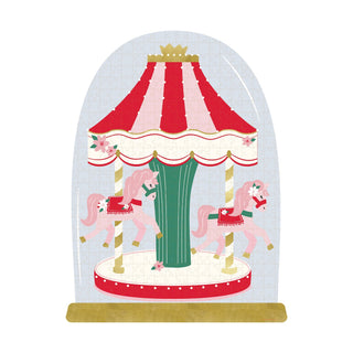 Illustration of a pink horse carousel with a red-and-white canopy on a wooden base, encased in a clear dome. Enjoy festive family fun with the My Mind's Eye Christmas Carousel | 250 Piece Jigsaw Puzzle.