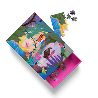 Animals of the Sumatran Jungle | 99 Piece Jigsaw Puzzle by Ohh Deer is a vibrant, jungle-themed puzzle featuring Natasha Durley’s distinctive animal illustrations. Partially assembled alongside its open pink box with extra pieces inside, this colorful tropical puzzle makes a delightful animal-themed activity for all ages.