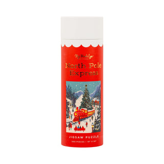 The North Pole Express | 500 Piece Jigsaw Puzzle by My Mind’s Eye comes in a red cylindrical box and showcases a festive train making its way through a snowy holiday village scene. Adorned with sparkling gold foil accents, this dazzling jigsaw puzzle is the perfect addition to your holiday season.