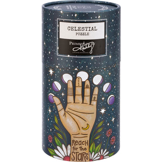 The Primitives by Kathy Celestial | 1,000 Piece Jigsaw Puzzle comes in a cylindrical box with an illustrated hand, moon, stars, flowers, and "Reach for the Stars" on a starry background—perfect for puzzlers.
