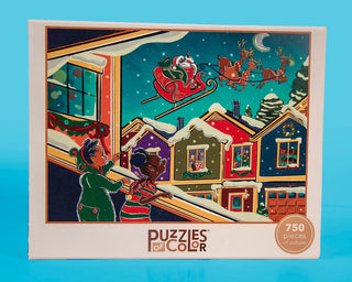 Twas the Night Before Christmas 750 Piece Jigsaw Puzzle box showing an illustration of two children looking out a window at Santa’s sleigh flying over a snowy Christmas neighborhood.