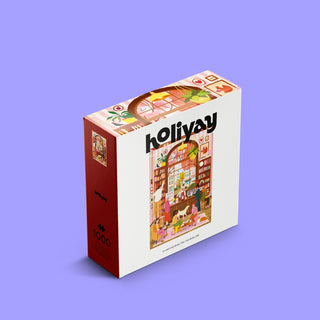 The Cozy Bean Café | 1,000 Piece Jigsaw Puzzle box showing an illustration of a cozy café filled with bookshelves, customers, and a dog.