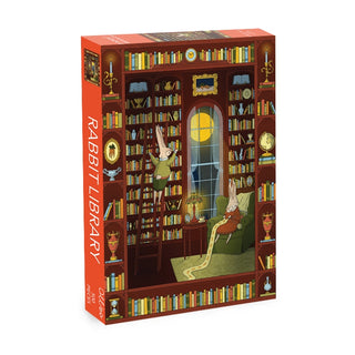 Experience the magic of the Rabbit Library | 500 Piece Jigsaw Puzzle by Olleo Puzzles, showcasing a captivating scene of two rabbits in a cozy book-filled library—one nestled in a chair reading, while the other scales a ladder to select a new adventure. Ideal for book enthusiasts and puzzle lovers, this delightful Olleo Puzzles creation guarantees hours of relaxing enjoyment.
