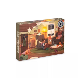 Cozy Reading | 500 Piece Jigsaw Puzzle by Trevell features artwork by Giulia Varetto, depicting a warm and inviting living room scene where people unwind with their favorite books. This puzzle beautifully captures the comfort of quiet moments at home, making it an ideal choice for book lovers and anyone who cherishes peaceful afternoons.