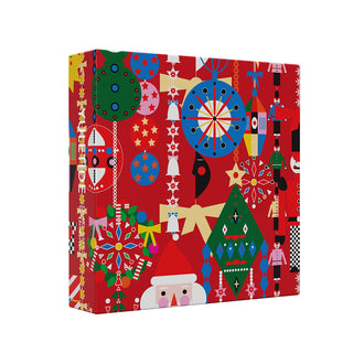 The Yuletide | 1,000 Piece Jigsaw Puzzle by Cloudberries comes in a square box with Santa, ornaments, trees, nutcracker soldiers, and stars on a red background. The spine reads YULETIDE—perfect for festive holiday puzzling!.