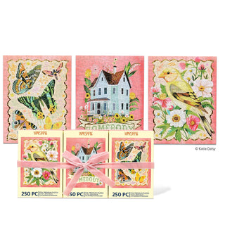 Three finished 250-piece puzzles—featuring butterfly, house, and bird designs—are displayed behind their boxes, neatly bundled with a pink ribbon. The Homebody | 250 Piece Jigsaw Puzzle Set by WerkShoppe showcases vintage-inspired imagery that adds botanical elegance to your downtime.