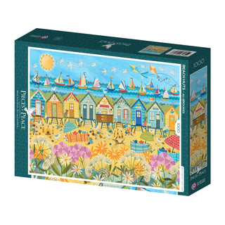 The "Beach Huts | 1,000 Piece Jigsaw Puzzle" by Pieces & Peace showcases Ali Brookes' art of vibrant beach huts, sailboats, flowers, and people on a sunny day—proudly made in France.