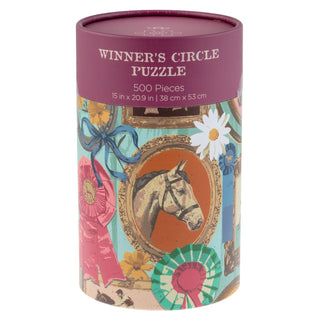 Winner’s Circle | 500 Piece Jigsaw Puzzle by Karma comes in a reusable cylindrical canister, featuring vibrant packaging with a horse illustration and colorful award ribbons.