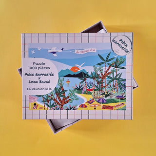 The La Réunion Lé La 1,000-piece jigsaw puzzle by Pièce Rapportée features an illustrated tropical scene from Réunion Island, with palm trees, people, and a plane on a vibrant yellow background.
