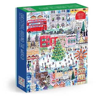 Enjoy the Michael Storrings Christmas Around the World 1,500 Piece Jigsaw Puzzle from Chronicle Books, featuring vibrant city scenes, iconic landmarks, and a grand central Christmas tree—all illustrated by artist Michael Storrings.