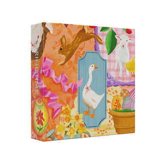 The Cloudberries Springtime | 1,000 Piece Jigsaw Puzzle features a vibrant box with a rabbit, lamb, goose, pink ribbon, yellow flowers, a potted plant, and patterned backgrounds—perfect for Easter or spring!.