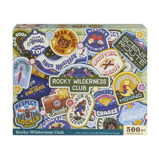 Whimsigo Rocky Wilderness Club 500 Piece Jigsaw Puzzle—a vibrant collage featuring colorful illustrated outdoor badges with wilderness themes like bears, rivers, camping, and hiking.