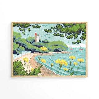 Noirmoutier L’anse Rouge by Aparté is a 1,000 piece jigsaw puzzle featuring a framed coastal scene with yellow flowers, sandy beach, lighthouse, sailboats, and green foliage—ideal for puzzle enthusiasts and seaside lovers.